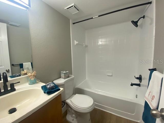 The guest bathroom is so fresh with its bright white newly coated walls and shower/tub combo. All new bathroom sink, towel bar, and shower fixtures. New toilet and light.