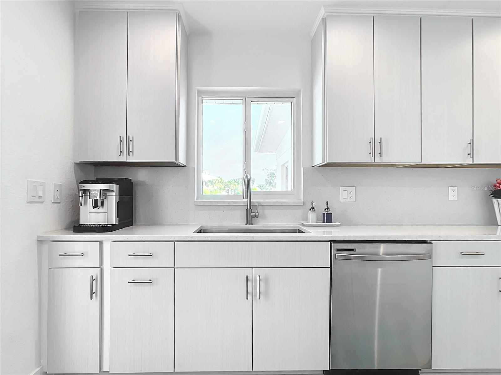 Modern neutral kitchen cabinets and quartz countertops