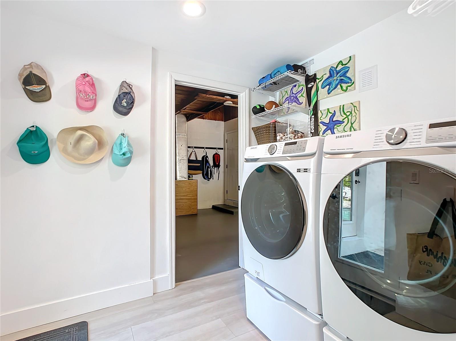 The laundry room features newer "Smart" Samsung washer/dryer.