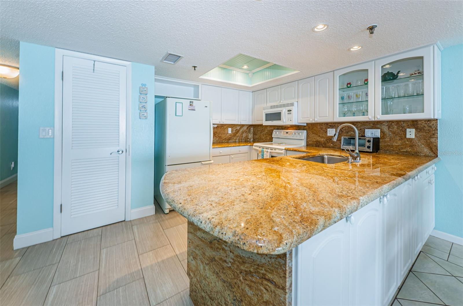 ...KITCHEN WAS MODERNIZED & OPENED A FEW YEARS BACK.. NICE OPEN CLEAN LOOK..PERFECT FOR ENTERTAINING . EXTRA STORAGE ON LIVING ROOM SIDE OF BREAKFAST BAR.