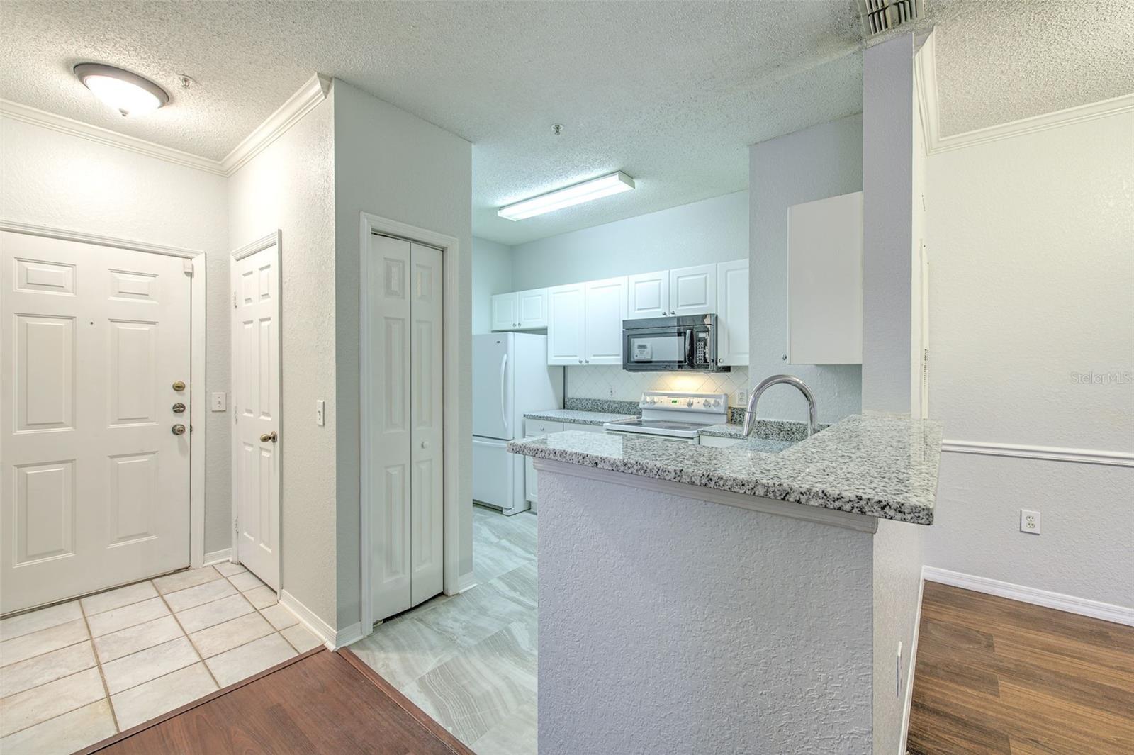 kitchen with breakfast bar, granite countertop