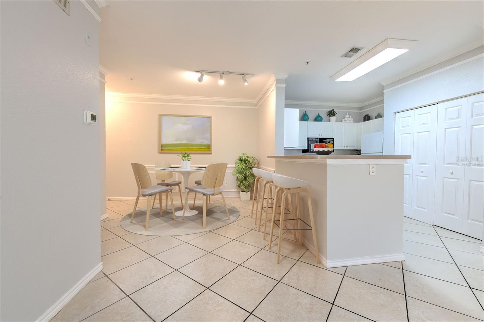 Virtually staged dining and kitchen area