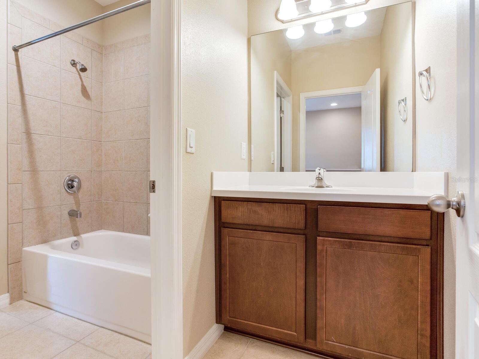 Jack and Jill Bathroom connected to two separate vanity rooms for each room