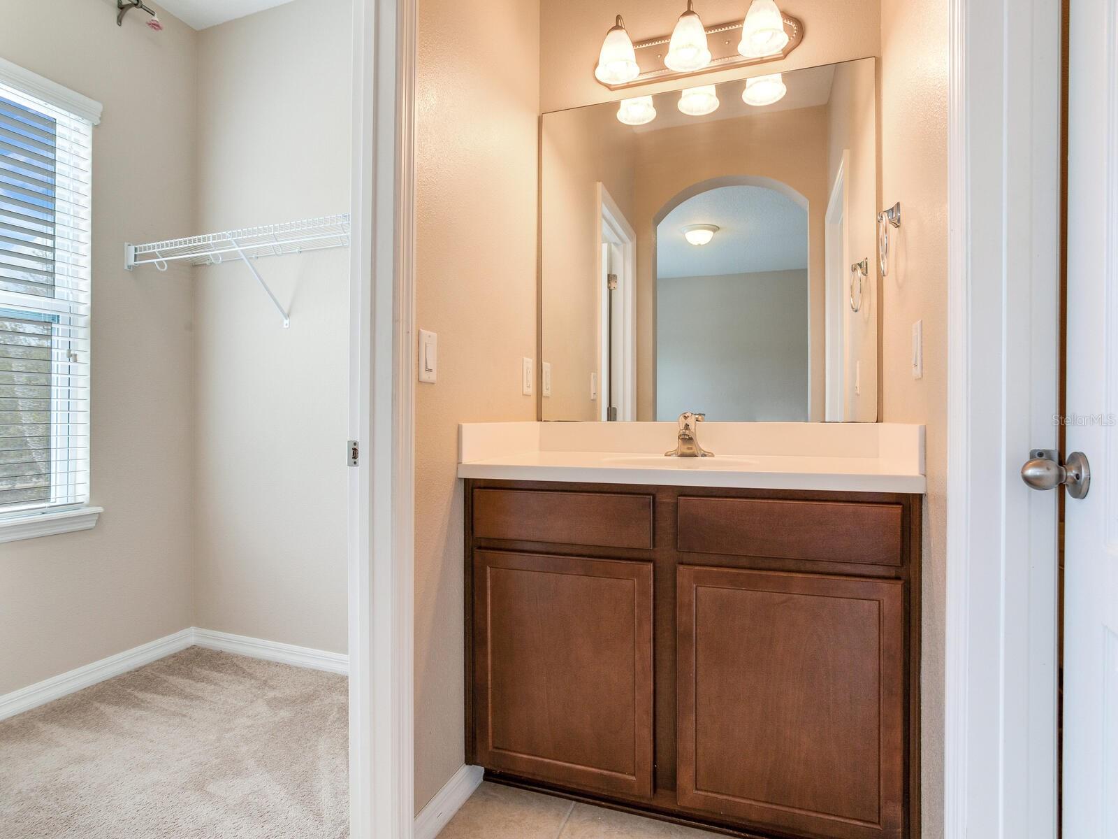 walk-in closet and another vanity room that connect to the jack and jill bathroom and toilet
