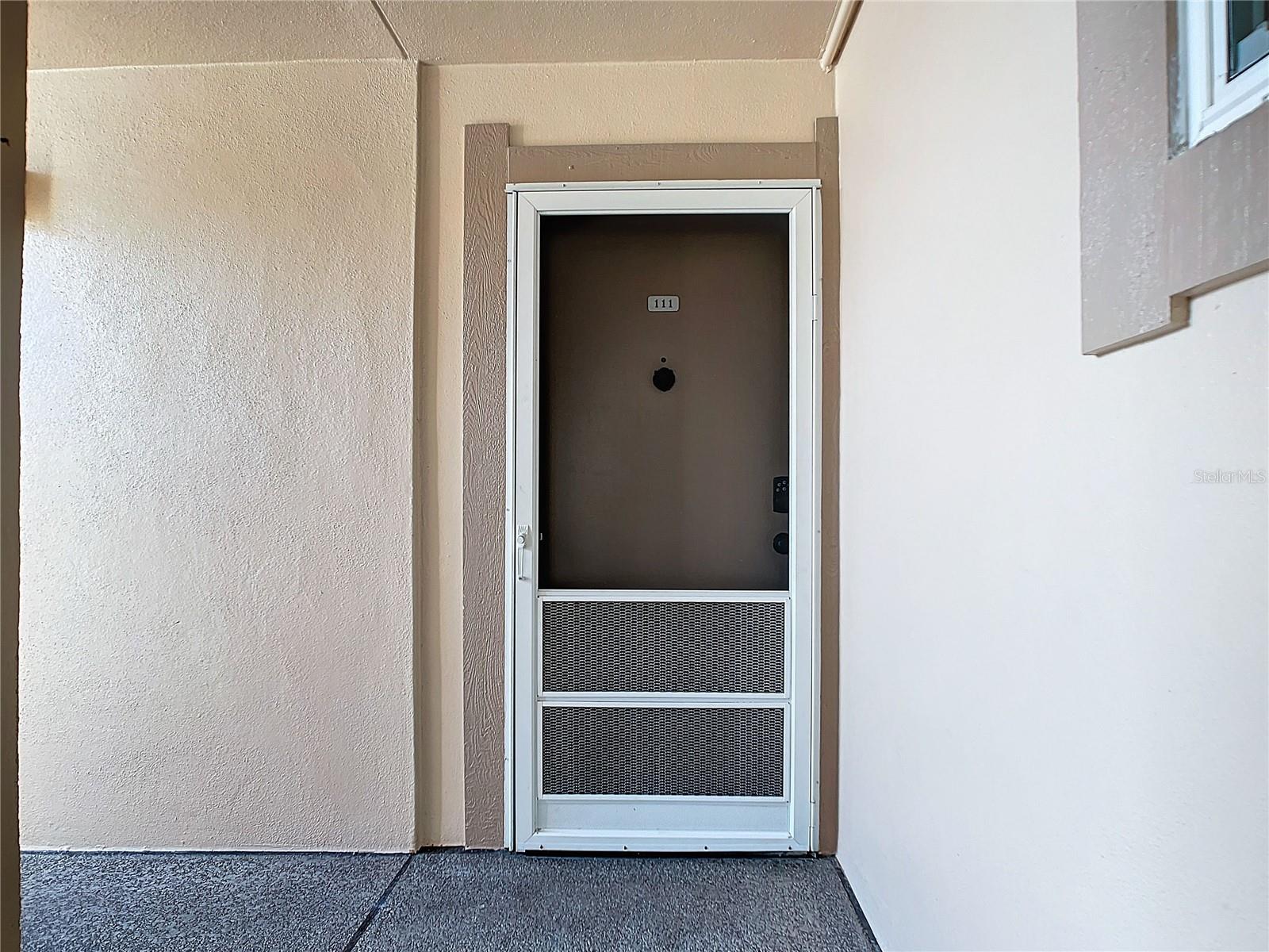 Front door / walkway is covered - steps from your carport.