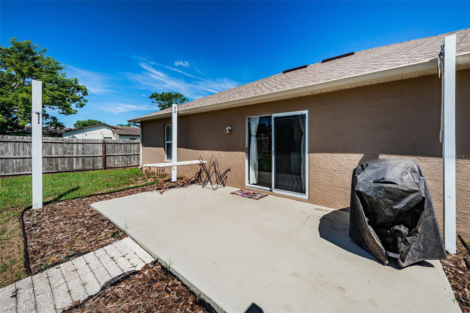 Patio for Grilling and large metal shed for extra storage