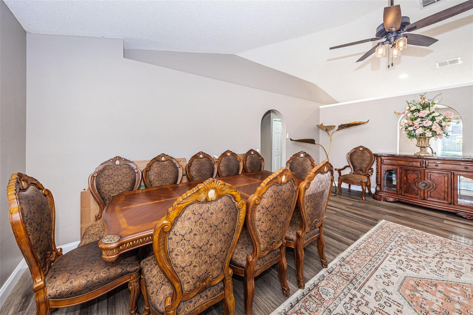 Living Room/Dining Room. Newer Vinyl Wood Flooring throughout with crown molding