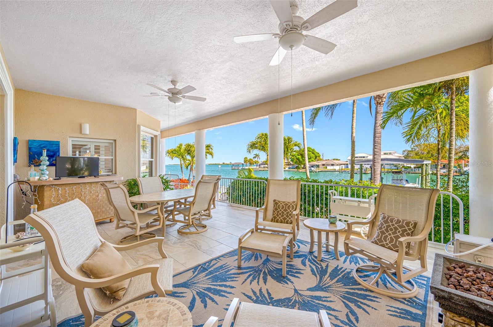 Lanai overlooking the water provides expanded living and entertaining area