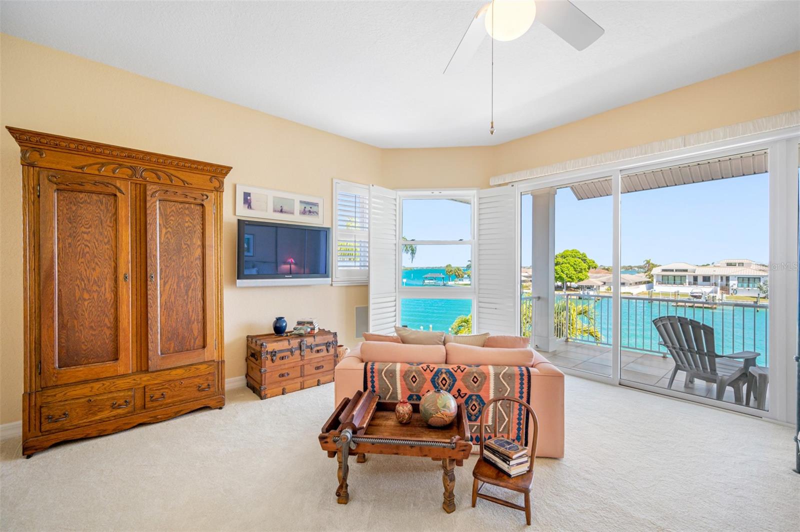 Additional view of primary bedroom suite sitting area and views of the Clearwater Harbor