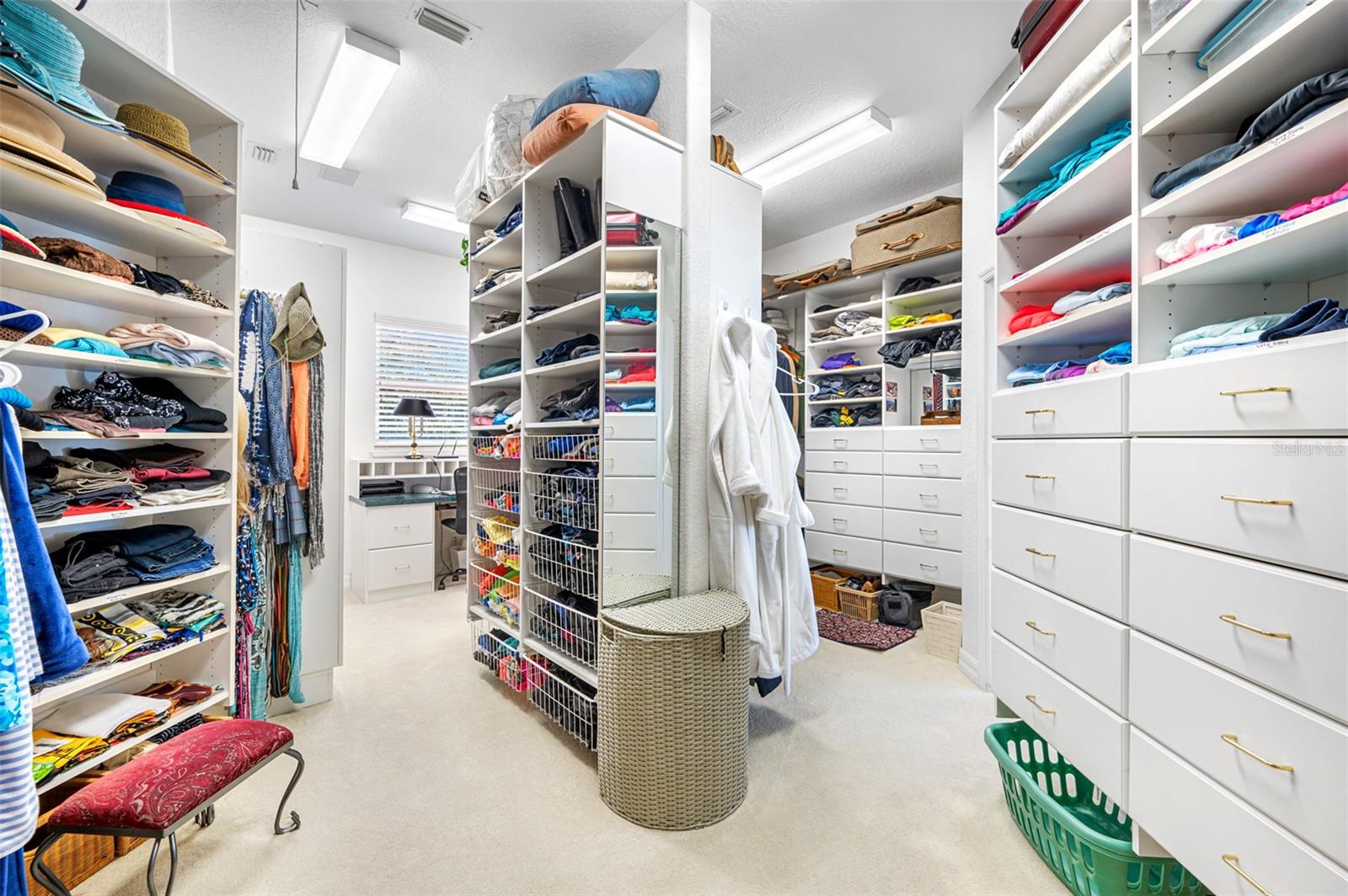 His-and-hers walk-in closets with extensive build out