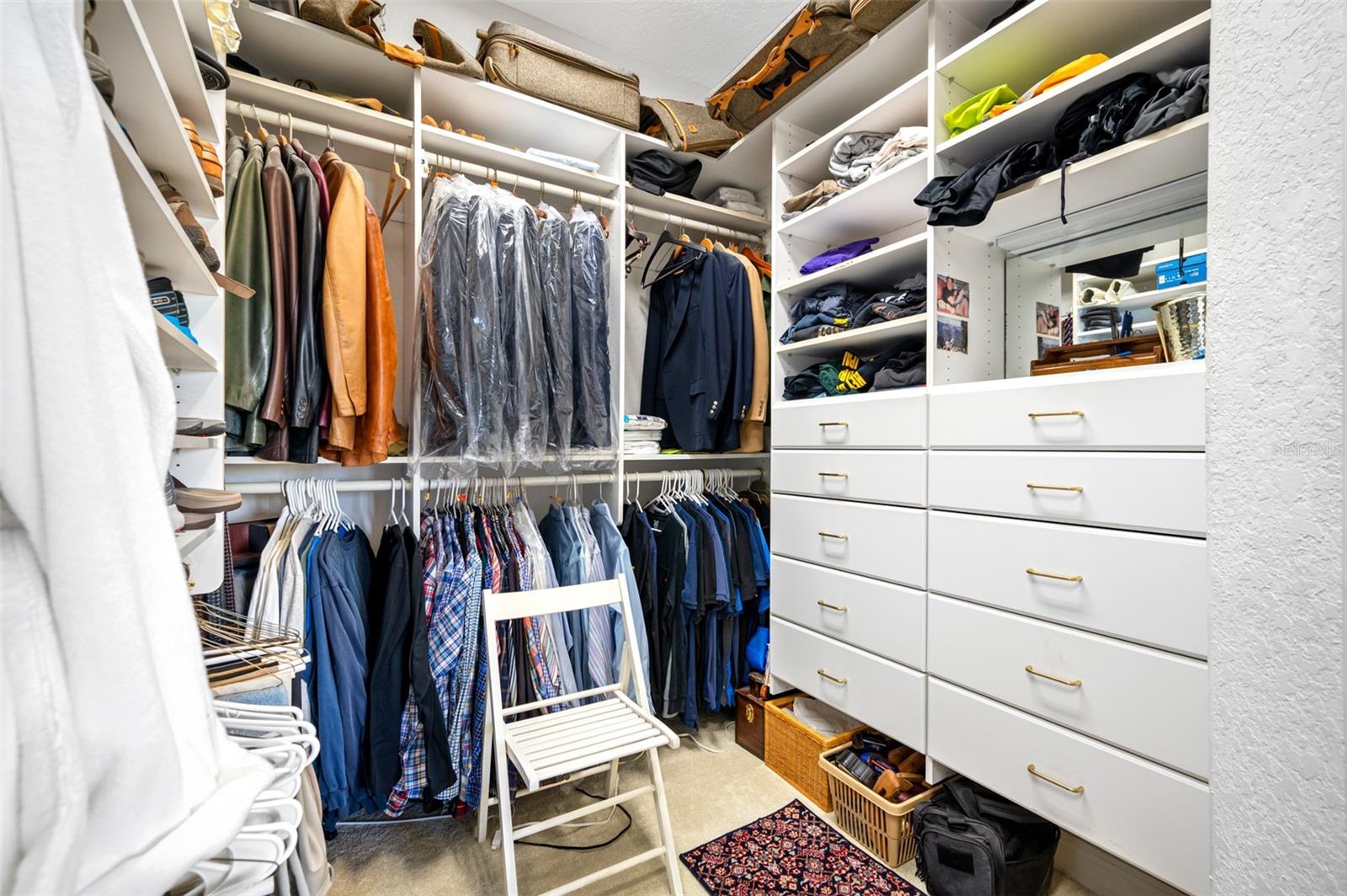 Additional view of his-and-hers walk-in closet
