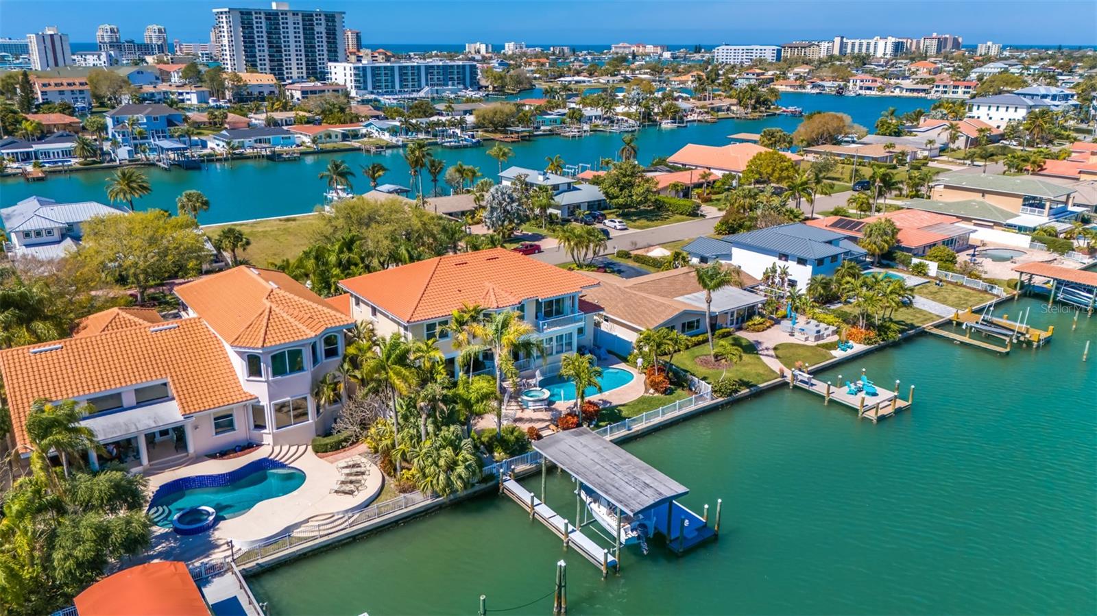 Aerial view of rear of property facing NW showing the waterfront community of Island Estates