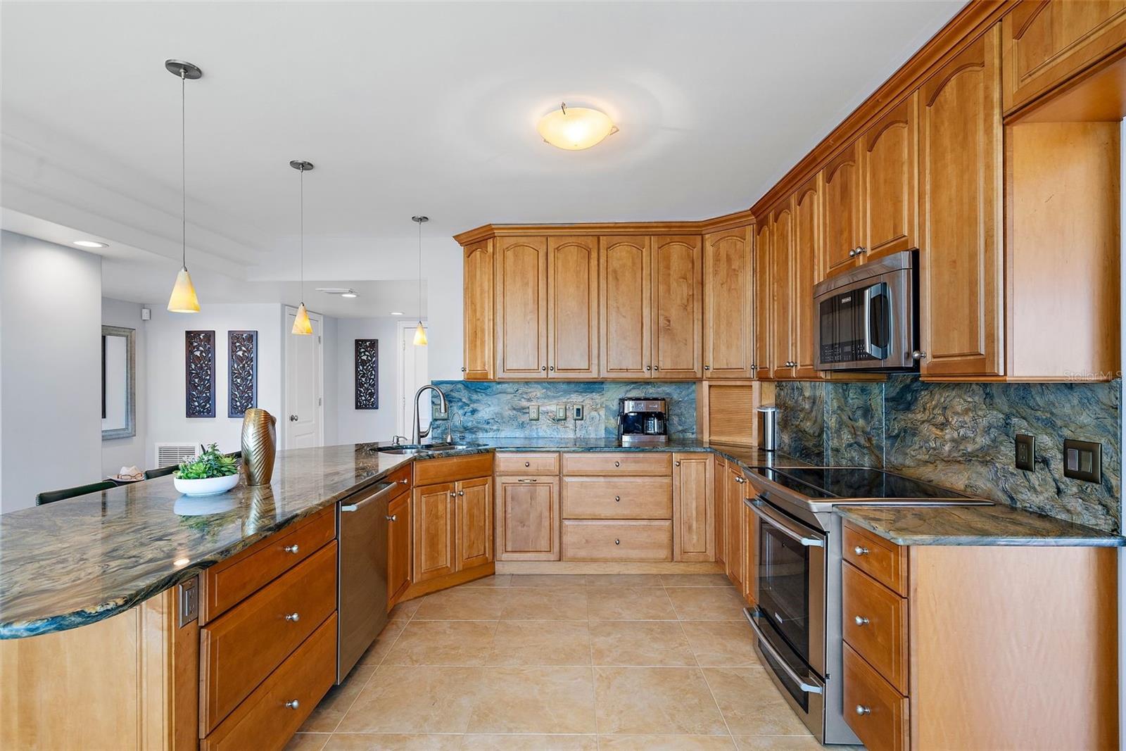 The solid wood cabinetry and beautiful stone countertops/backsplash are timeless.