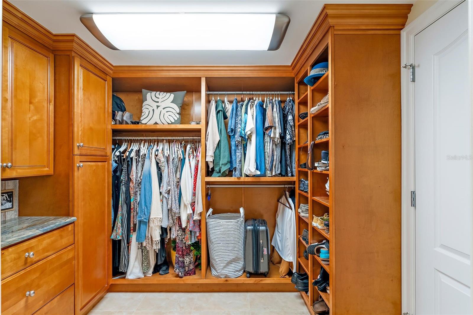 The ante-chamber with built-in closets that dreams are made of, leads to the primary bathroom. This Primary Closet measures 8' X 9'.