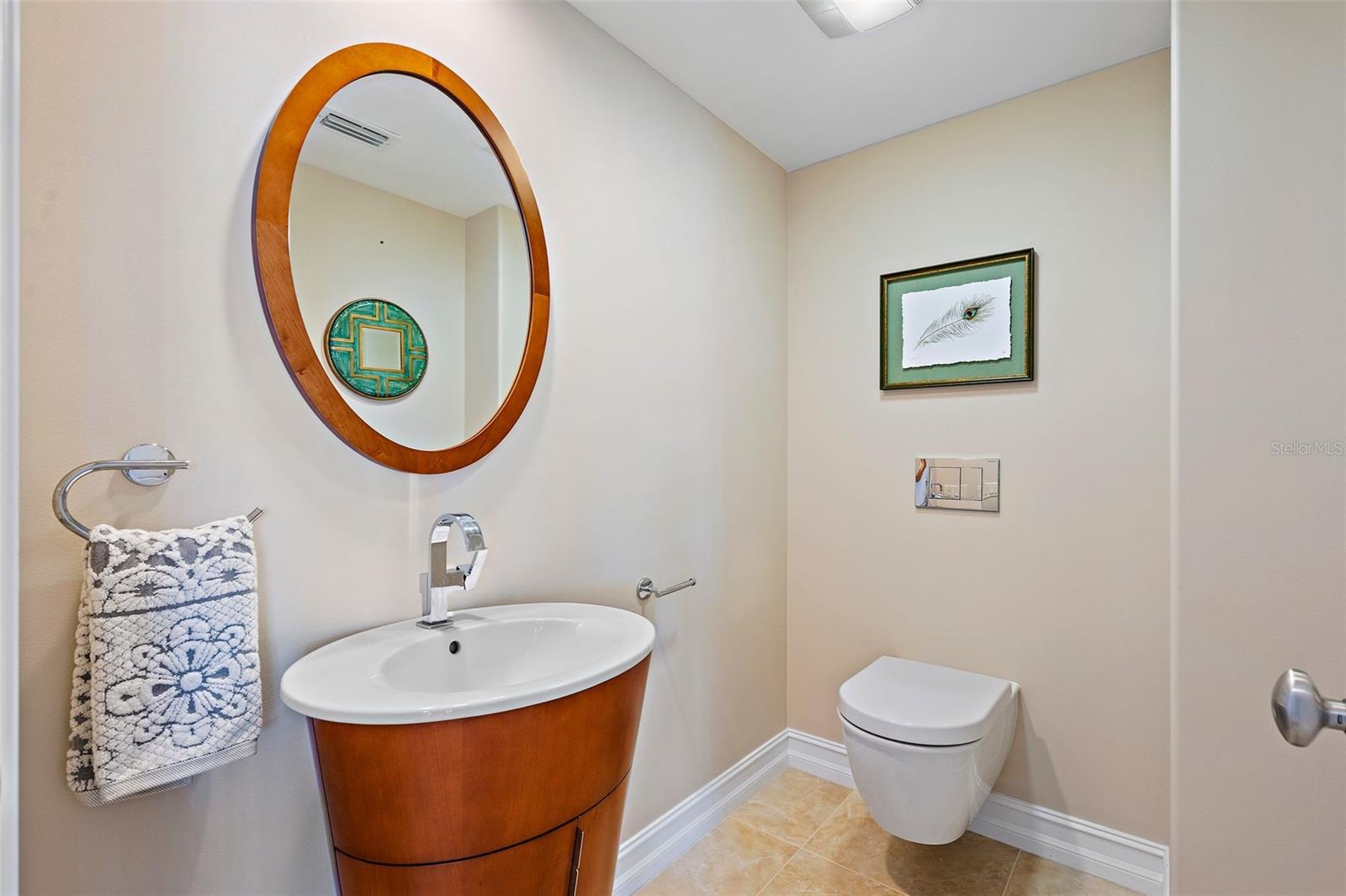 The half bath has a hanging toilet, which makes cleaning a breeze! It also looks fabulous!