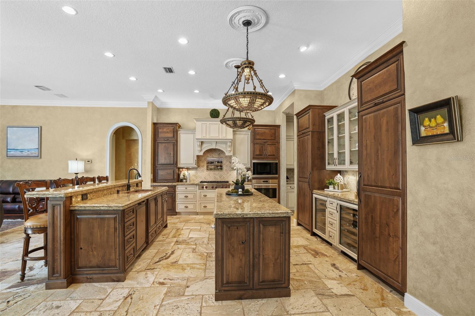 Double island, double stacked granite kitchen.