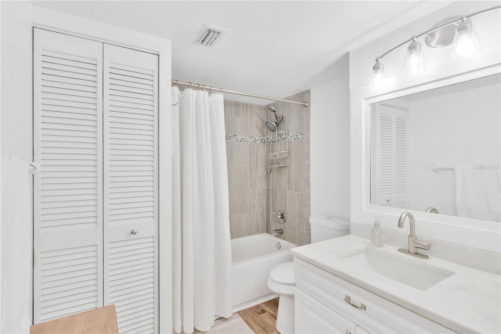 Equally as impressive is the Guest Bathroom with tile tub/shower combo & closet space.
