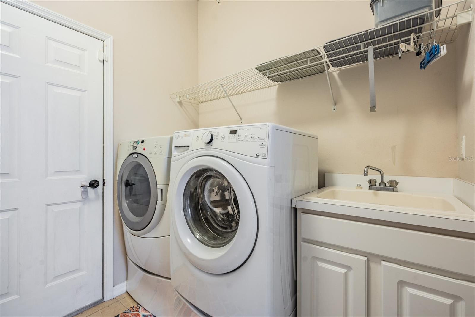 interior laundry room with utility sink