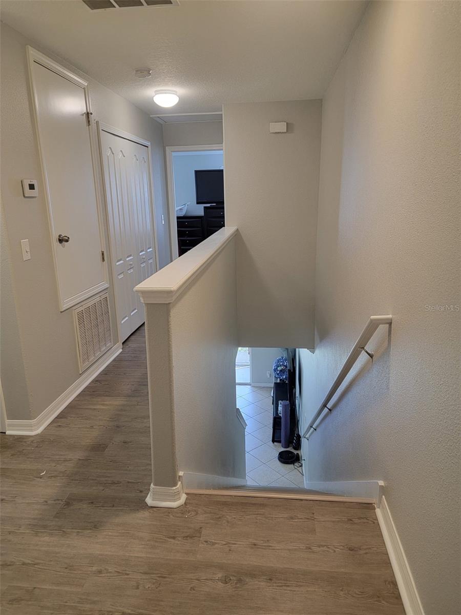 Stairwell, landing and extended Hall to Master suite