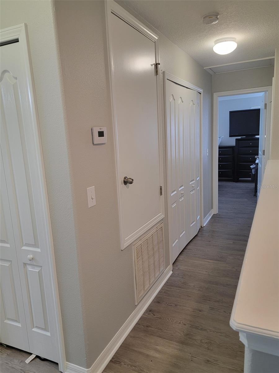 Hallway exiting Master suite with enclosed laundry area