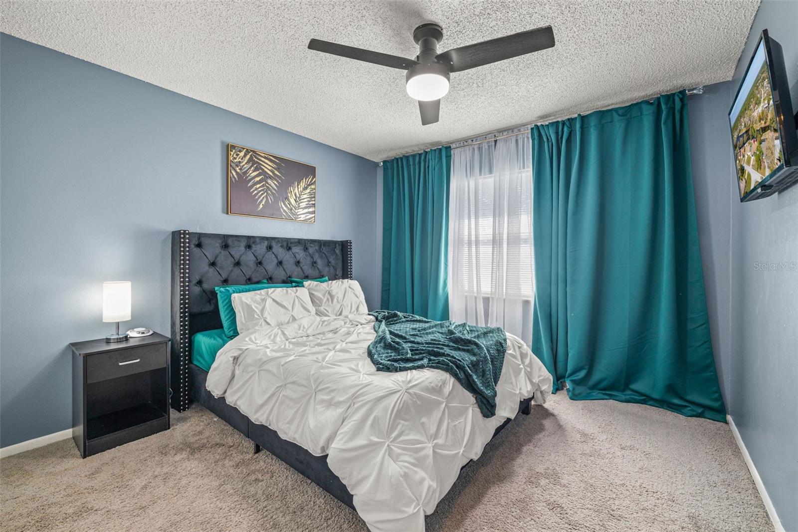 Large secondary Bedroom #2, also with on trend paint color and updated ceiling fan.
