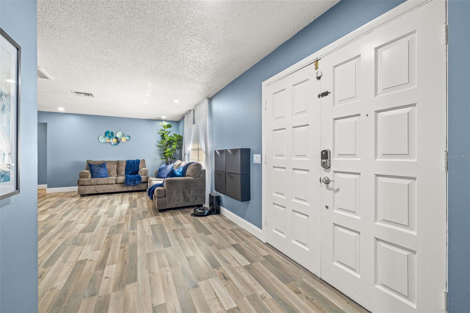 As you enter the home, you'll immediately notice the on-trend paint colors and bright open floor plan.