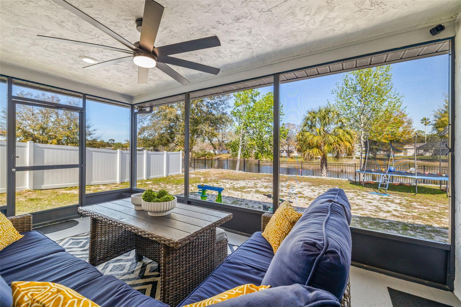Enjoy the pond view from your screened in lanai with fresh screens and a new ceiling fan! Perfect place for that morning cup of coffee or evening glass of wine!