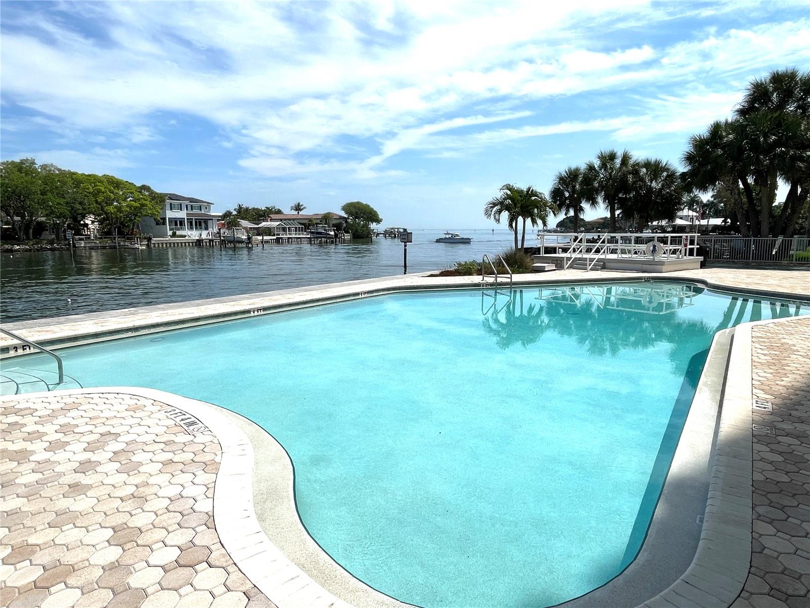 Updated HEATED free form pool and deck with fantastic open water view!