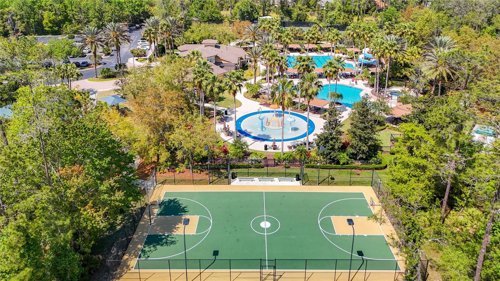 great view of Some of the many amenities offered at clubhouse no additional fees to use pool or tennis courts or basket ball, ther eis a volley ball court near by as well.