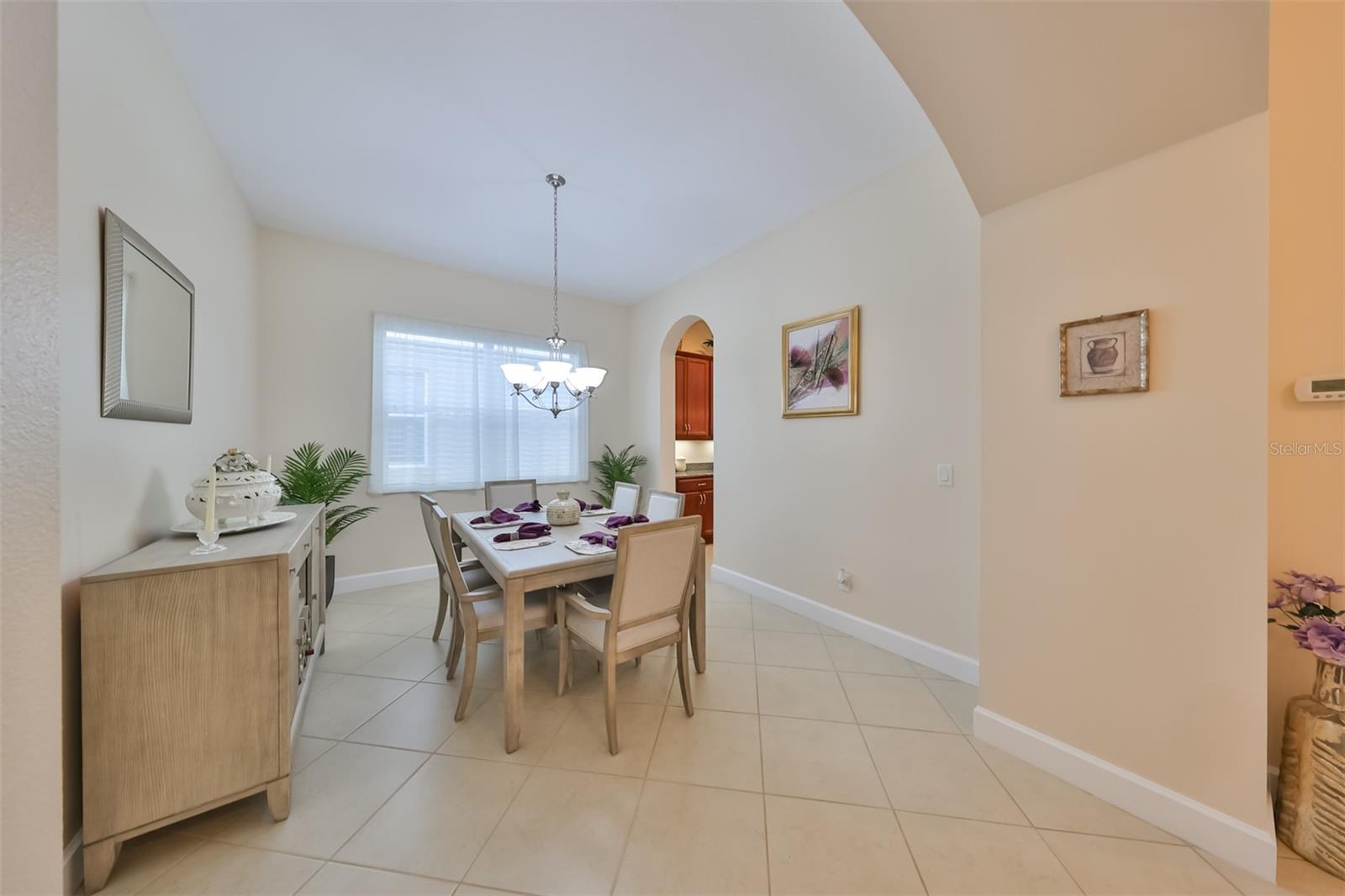 Dining Room is easily accessible to the kitchen, but offers you the privacy of not looking at the dirty dishes!  THIS MODERN FURNITURE SET CONVEYS WITH THE SALE OF THE HOUSE.