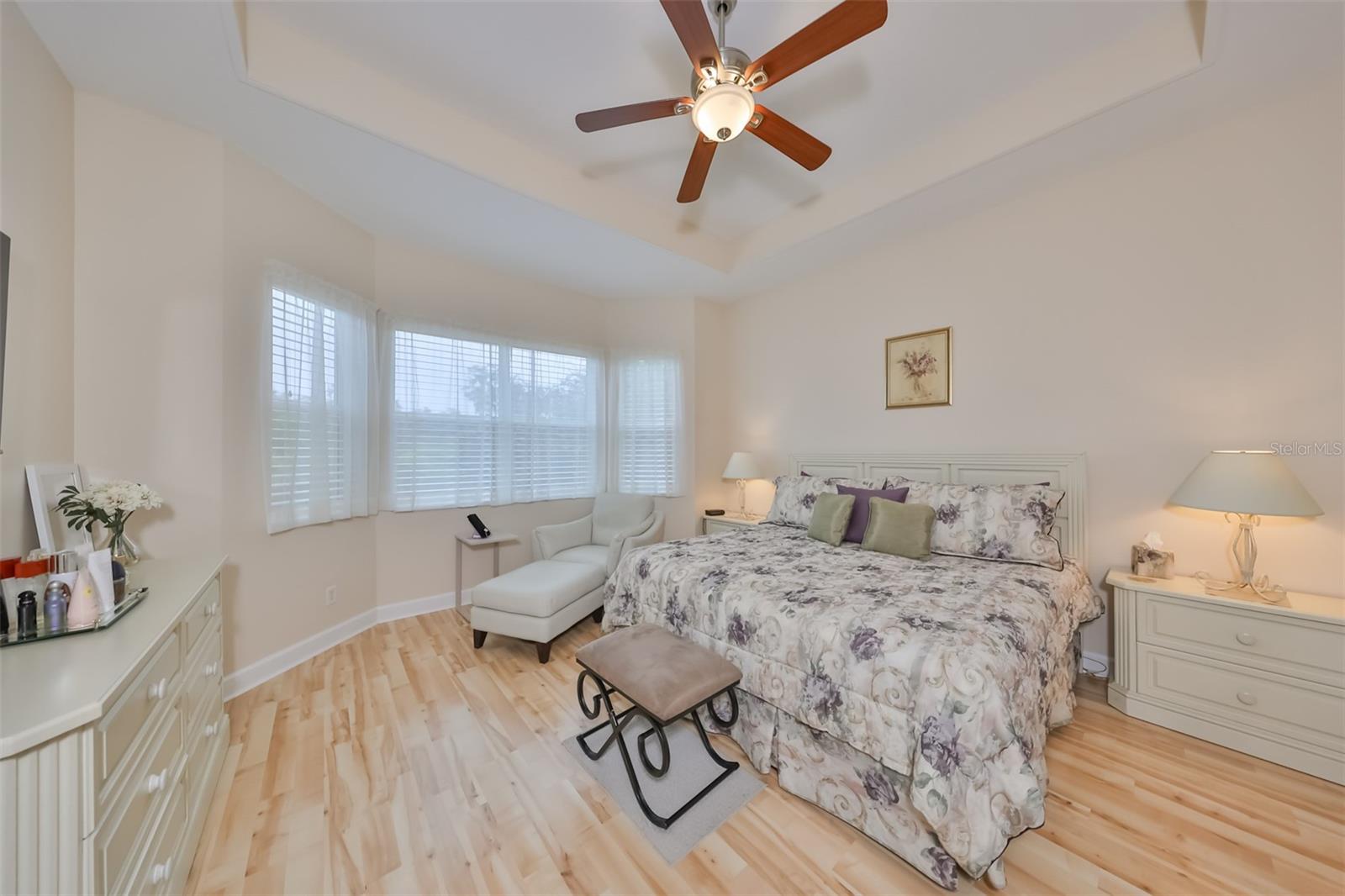 Primary Bedroom has a stunning view of the Manatee State Park.  The beautiful laminate flooring handsomely accepts this entire room.