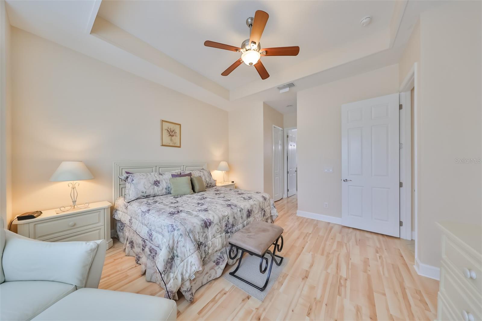 Primary Bedroom has a trey ceiling, walk-in closets and that uncluttered, serene feel for ultimate relaxation.