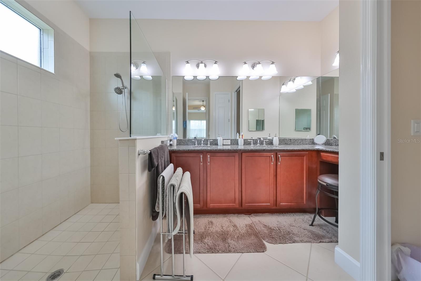 Ensuite Bathroom is stunning with red oak cabinets, large walk in shower, bright lights, granite counter tops and a private water closet.