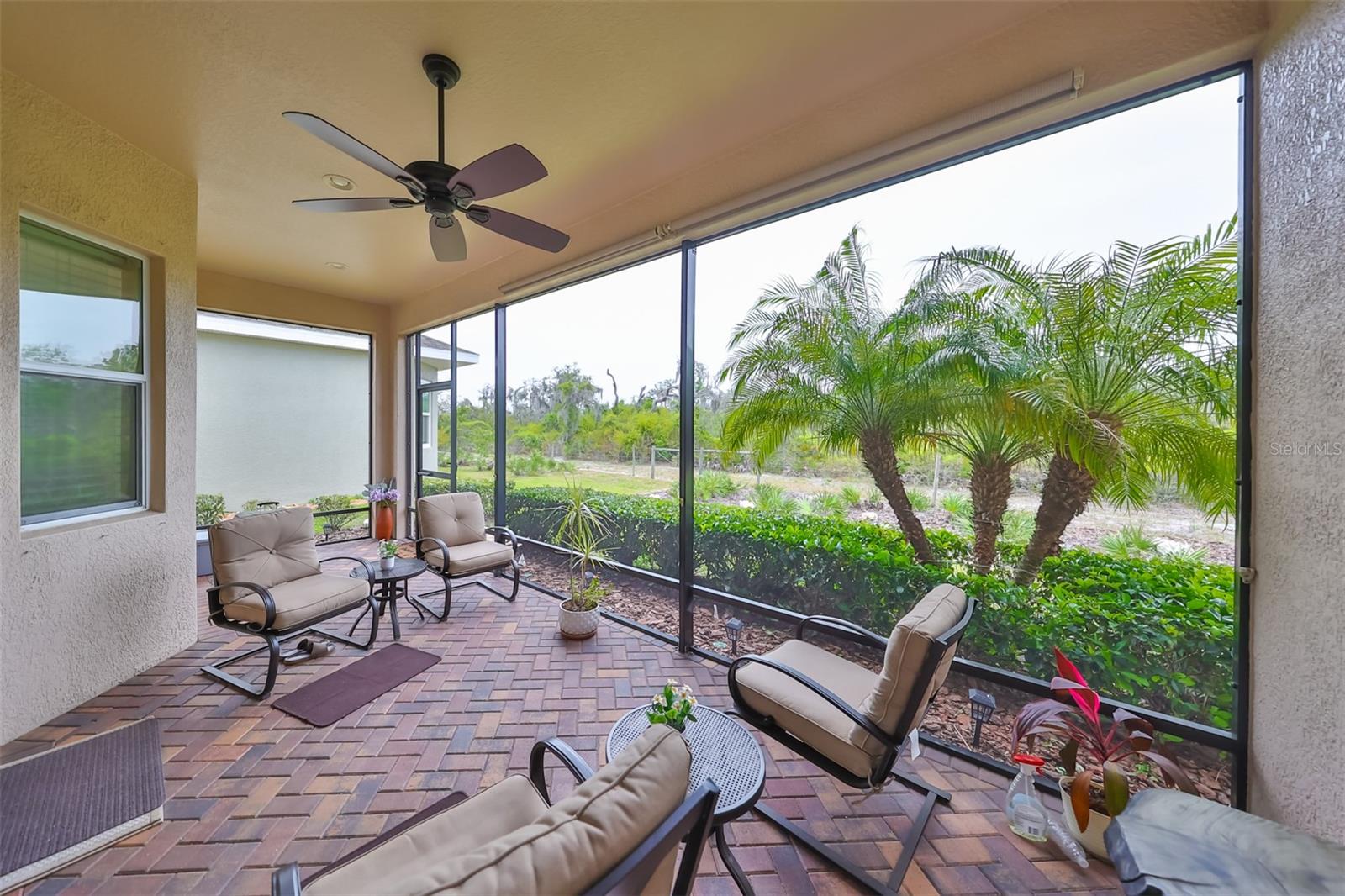 The lanai has ceiling fan, custom brick pavers and is enclosed so that you can enjoy this space all year round!
