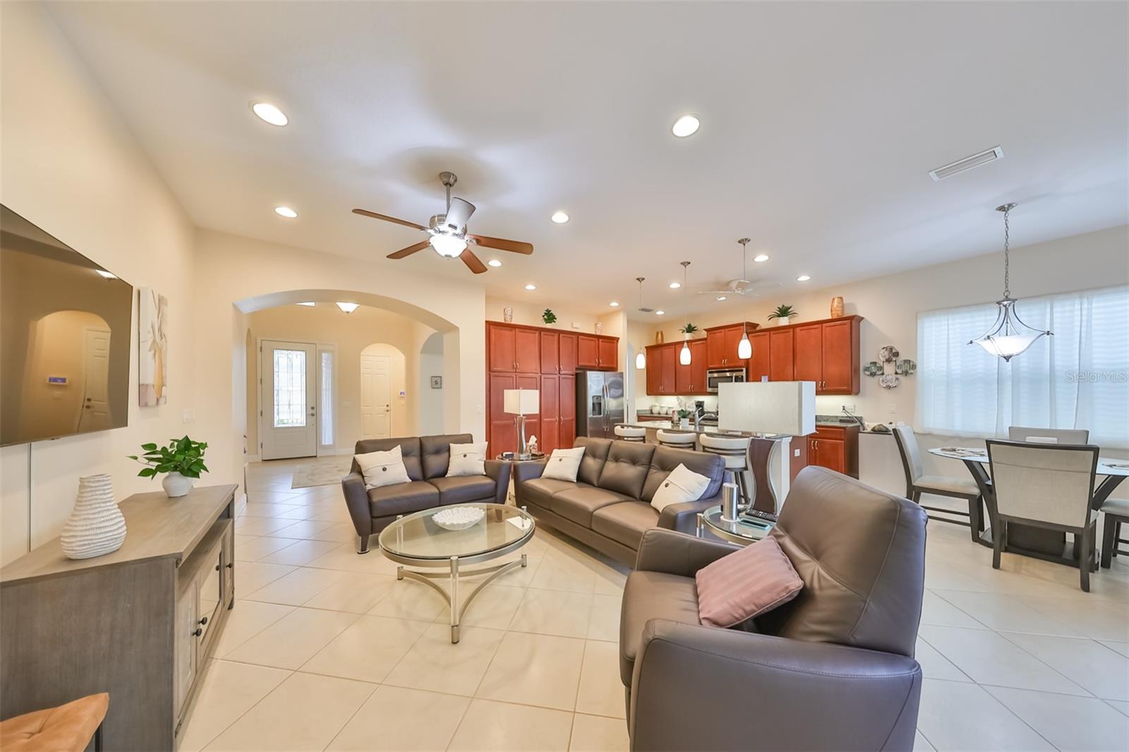 As you enter this home, you immediately walk into a bright open living space, with the guest bedroom and dining room to your immediate right and left (respectively).  Notice the high ceilings and arched doorways.