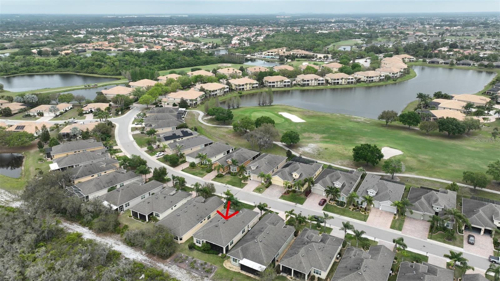 Ariel view of community, with home outlined in red arrow.