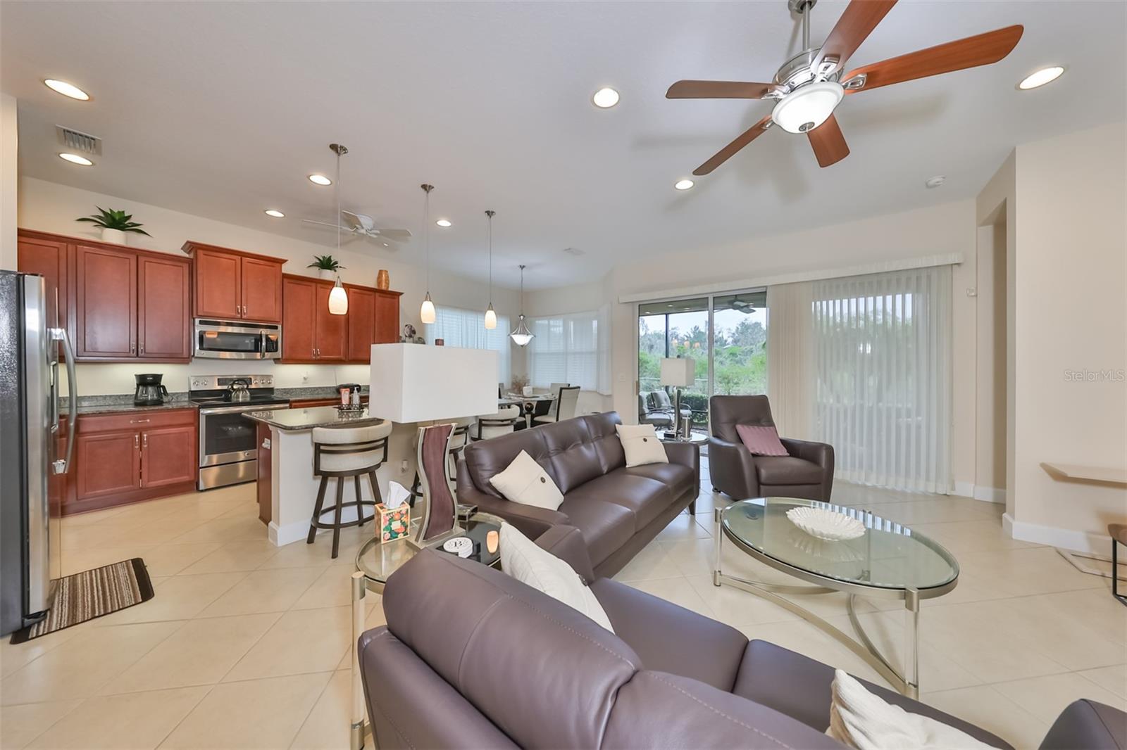 The living room is open to the spacious kitchen and has custom blinds throughout the home.  So you never miss out on the action.  And you have the views of the Manatee State Park from just about every room in the house.