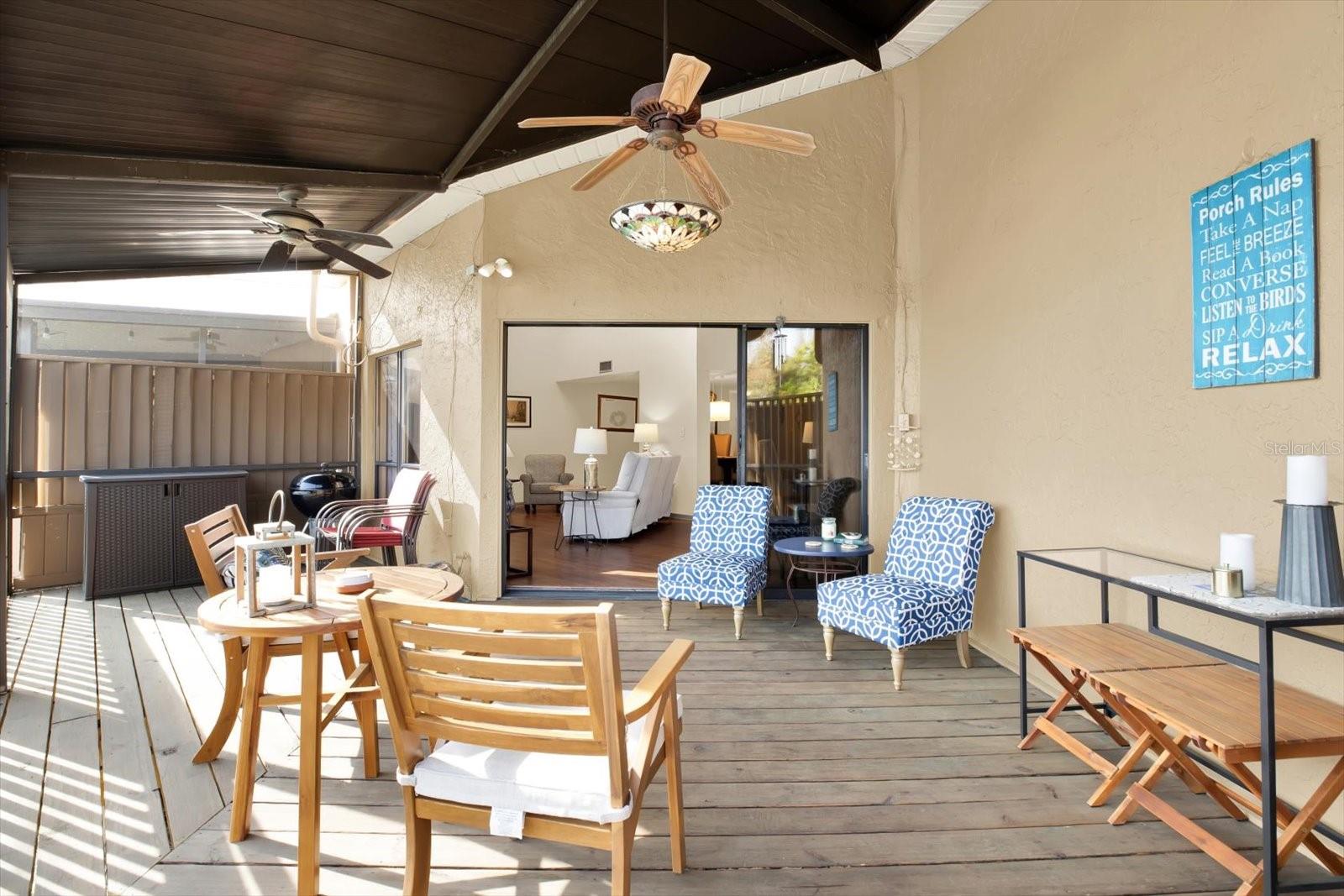Enjoy the Florida weather on the screened-in porch.