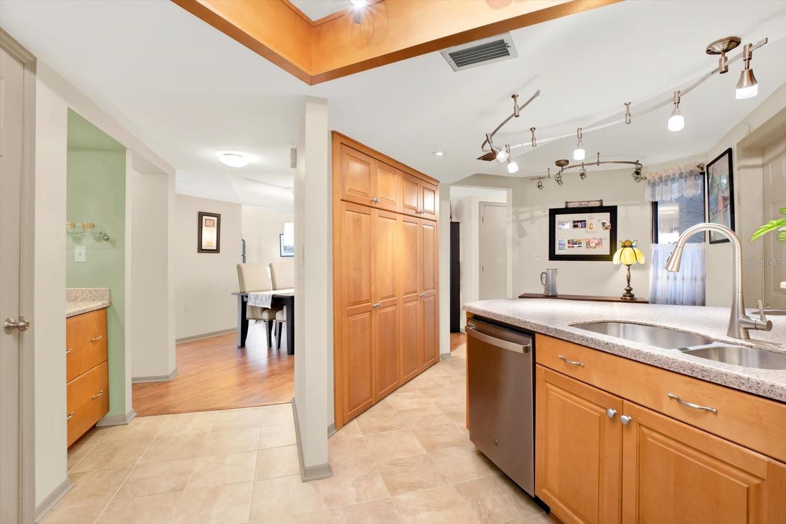 The kitchen has a double pantry storage and a wet bar.