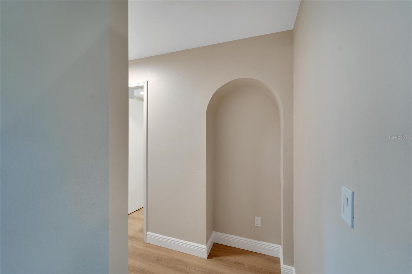 Unique arched wall niche, perfect for an arched bookcase or piece of art.  Notice the electrical outlet for your convenience.