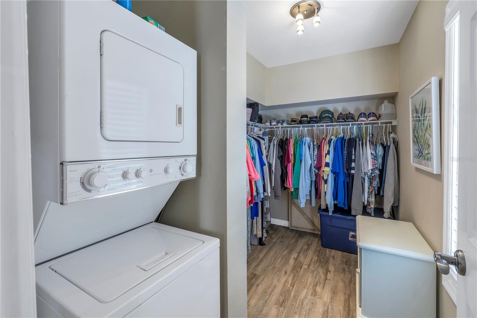 WALK IN CLOSET WITH INTERIOR LAUNDRY