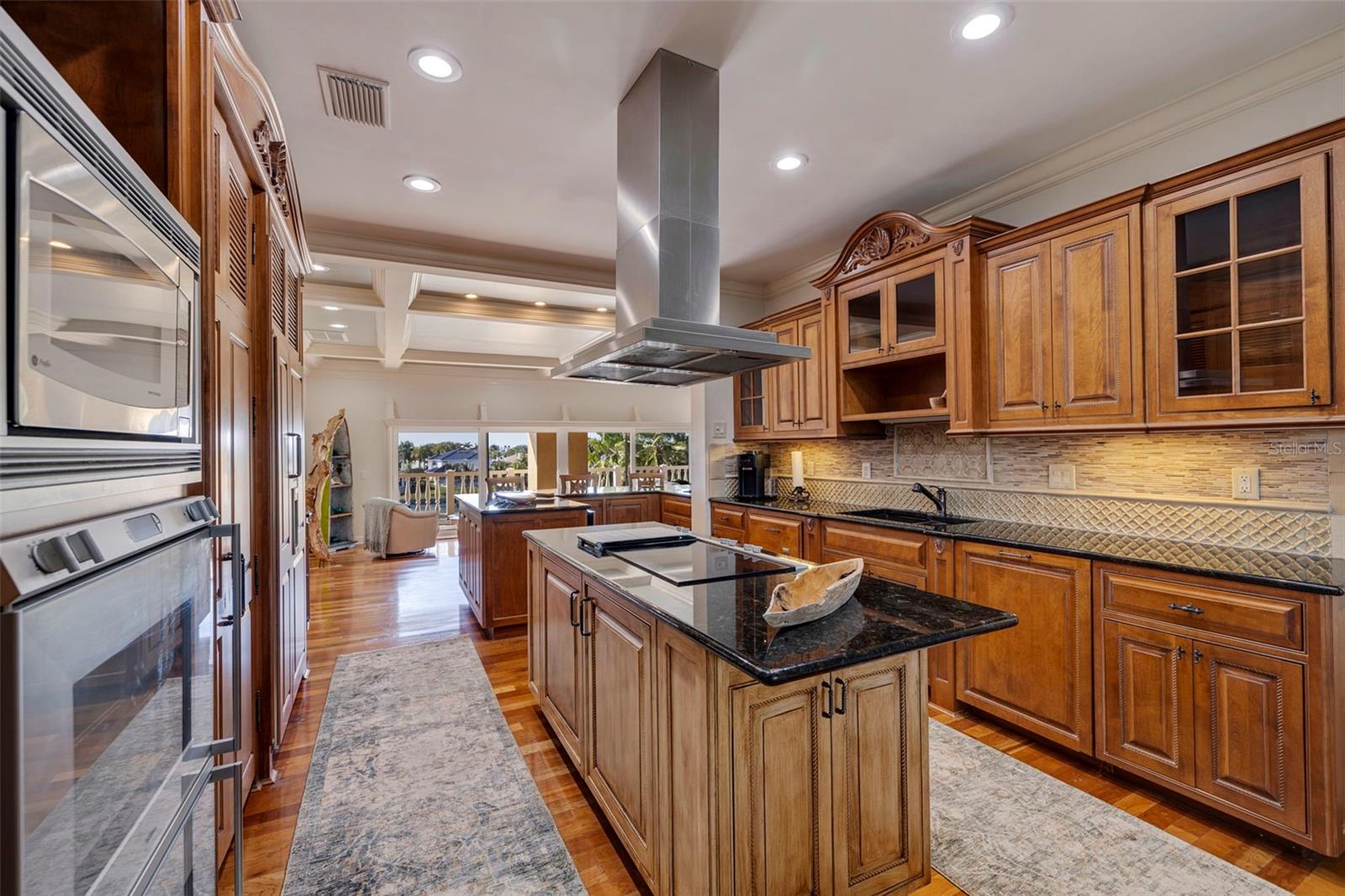 High end kitchen appliances including a huge walk in pantry and free standing ice maker.