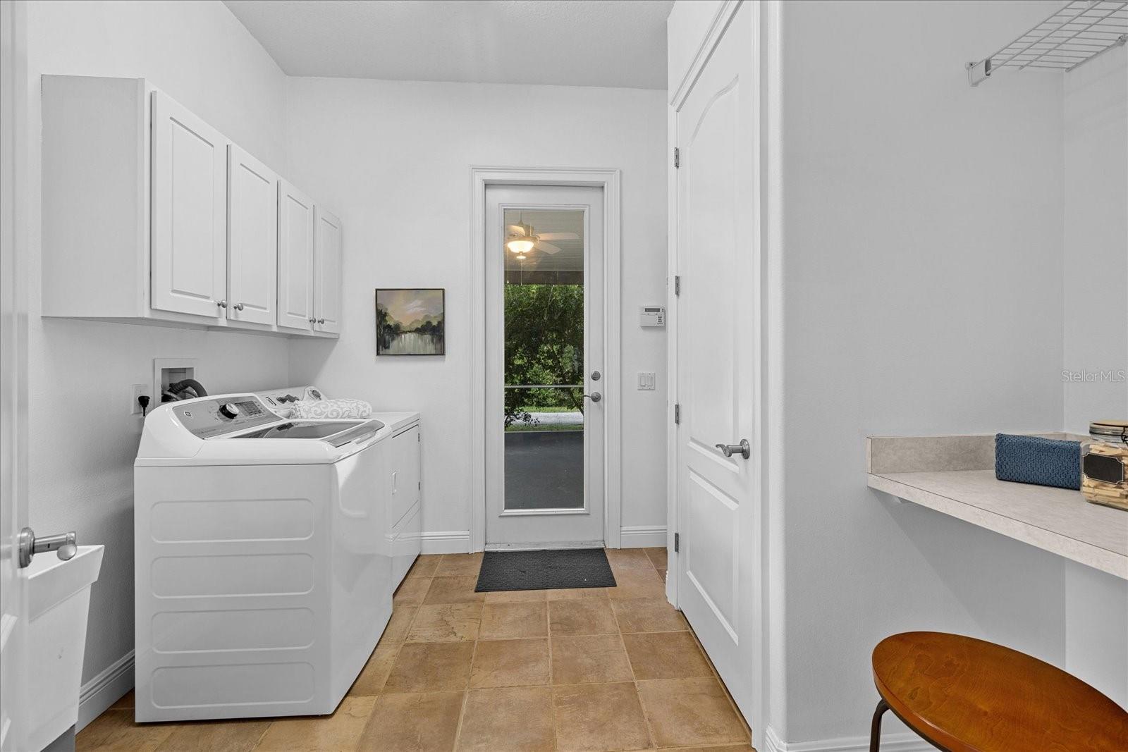 Large mudroom/laundry with exterior access.