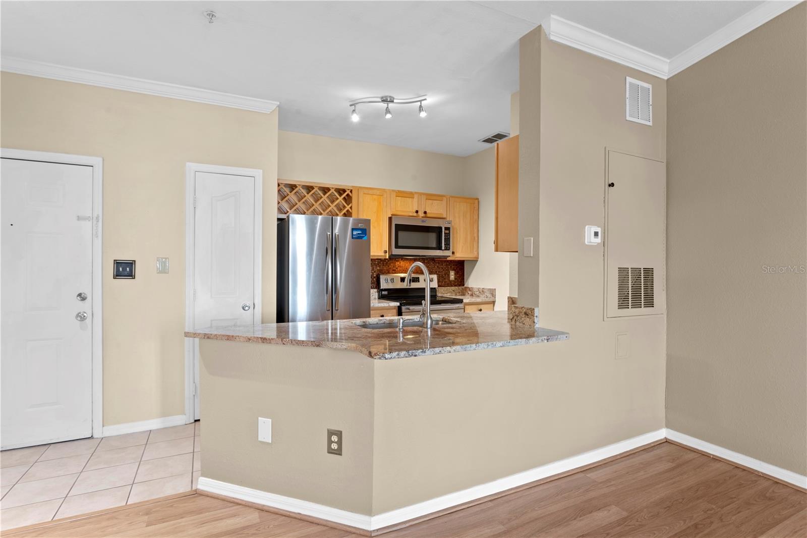 The kitchen opens to the large family room.