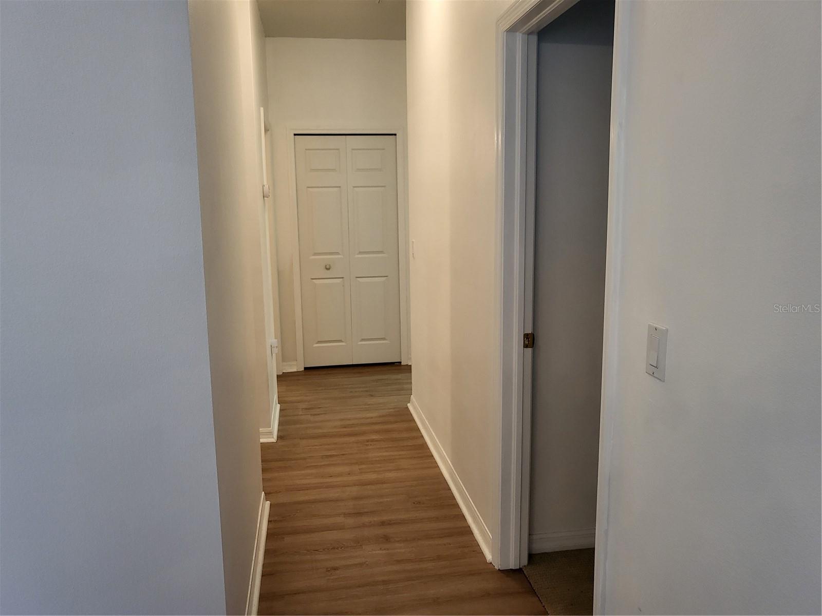CORRIDOR TO BEDROOMS AND UTILITY ROOM