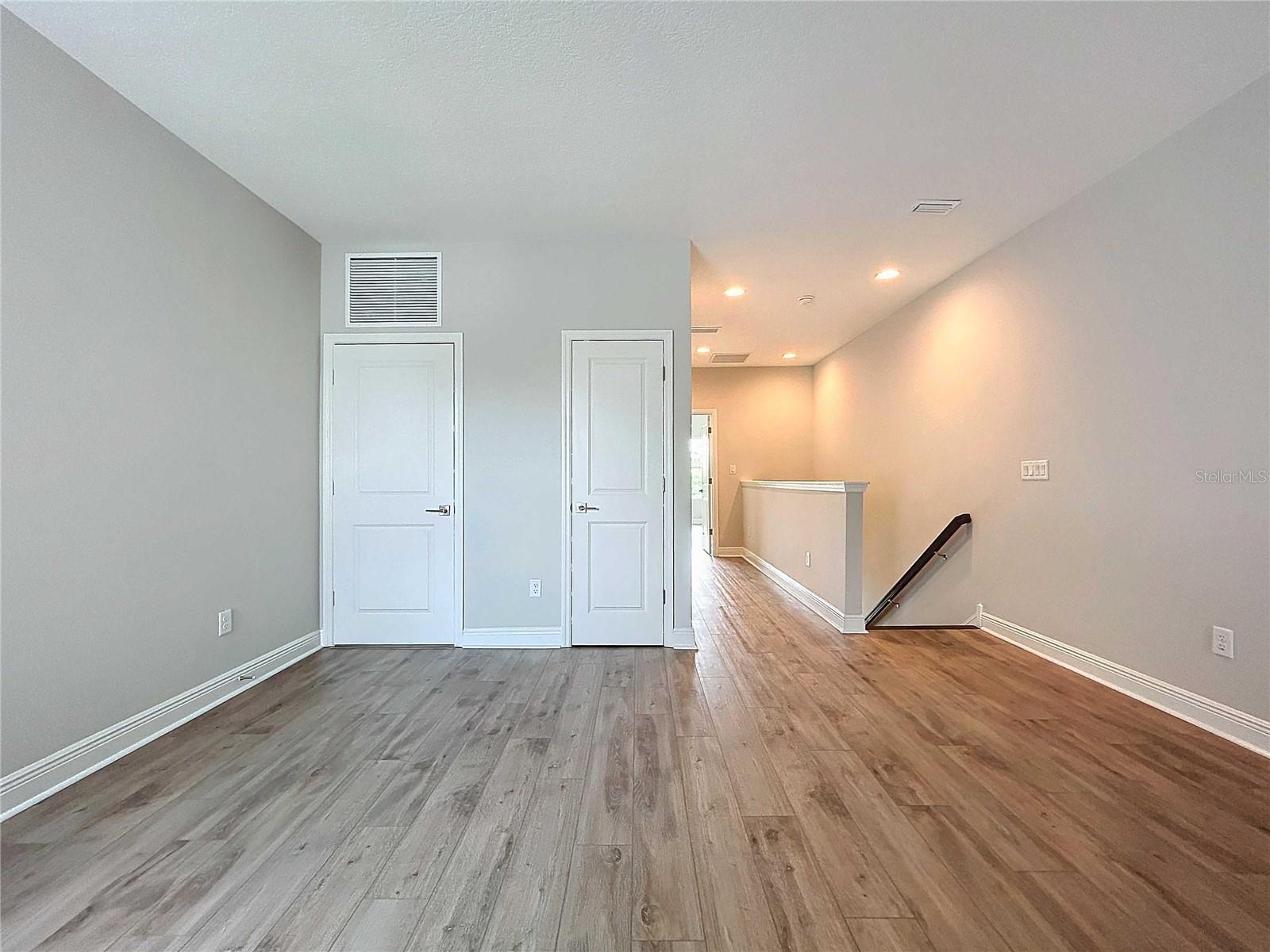 upstairs loft and hallway to primary bedroom