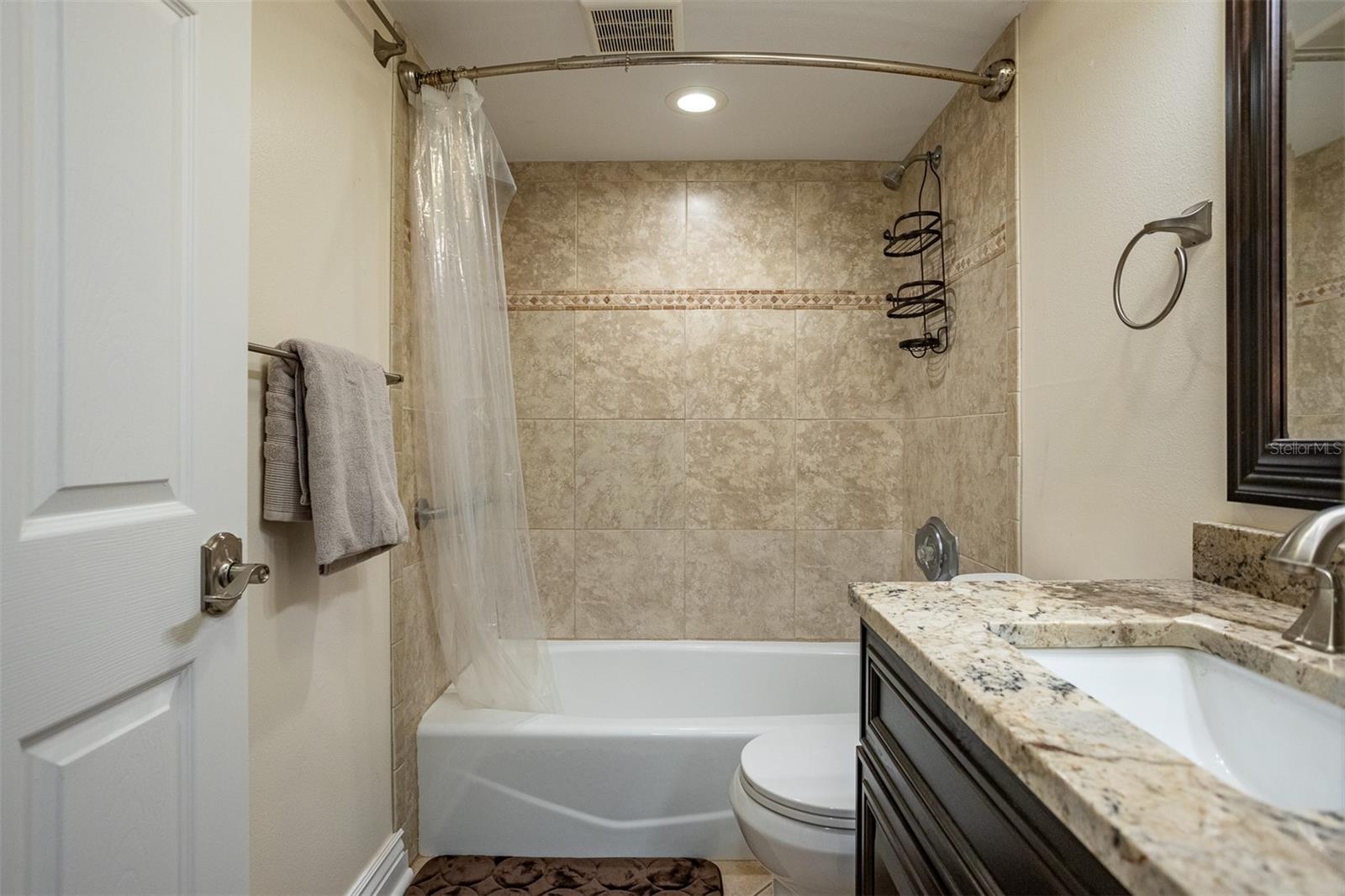Second bathroom with updated tile and fixtures