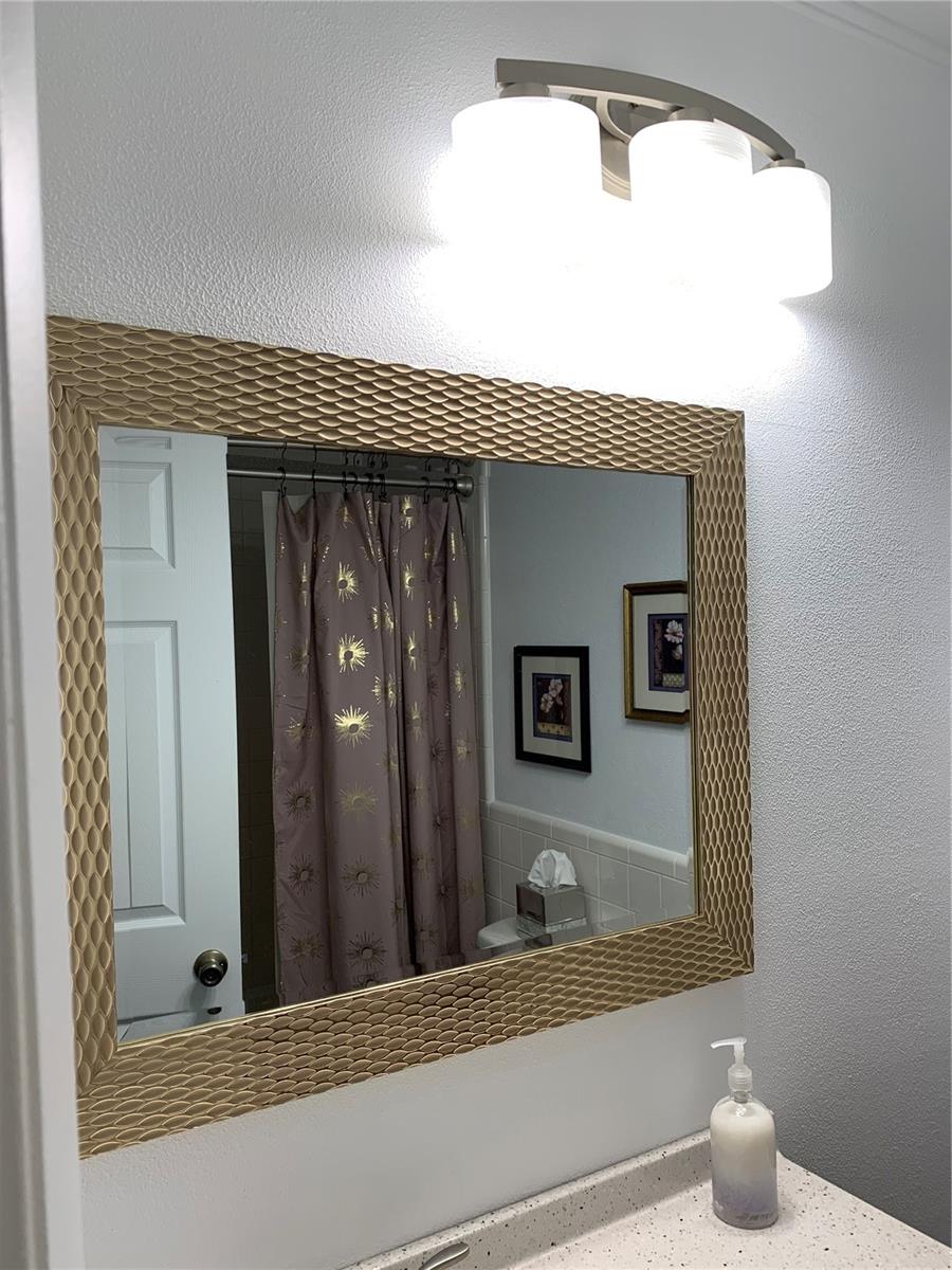 Large mirror in bathroom with Tub