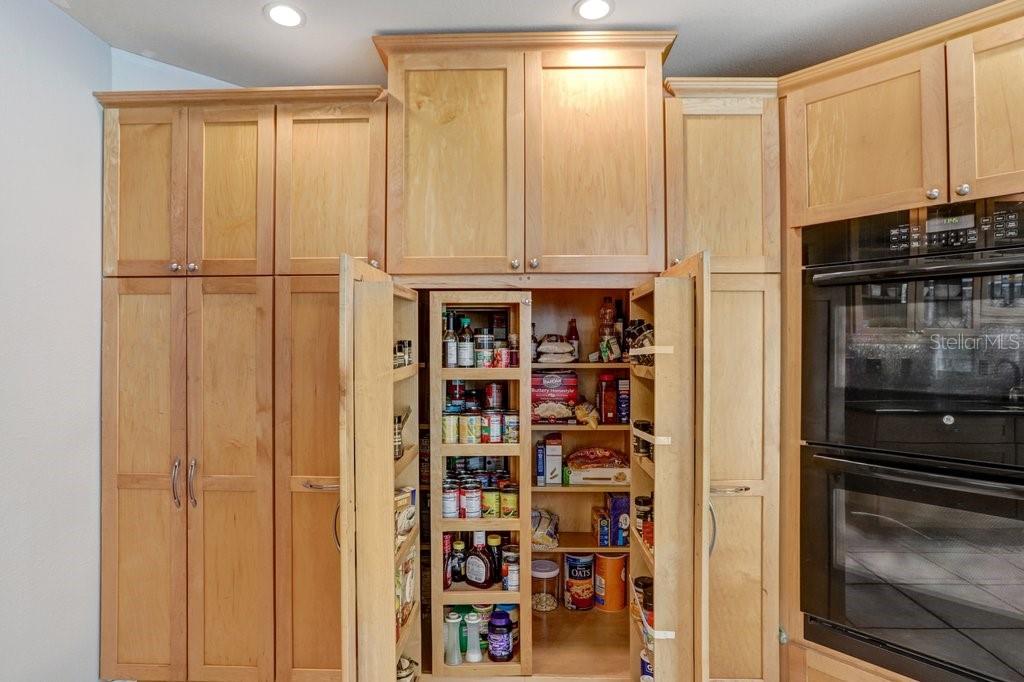 Custom cabinetry with pull out pantry