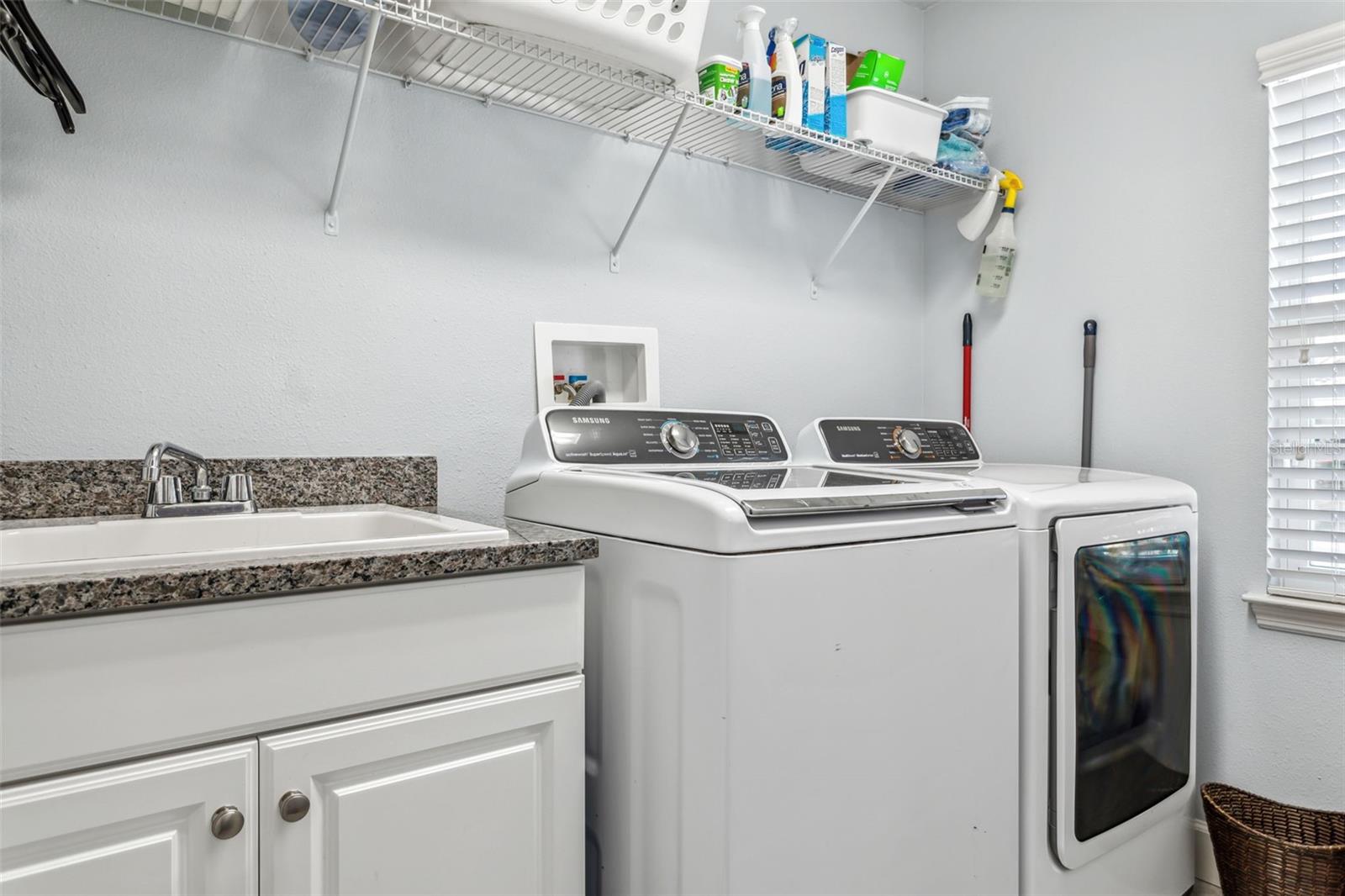 Tucked away laundry room with washer and dryer included!